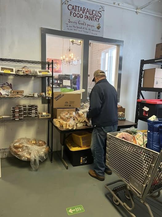 Two women in the pantry showcasing FeedMore WNY partnership