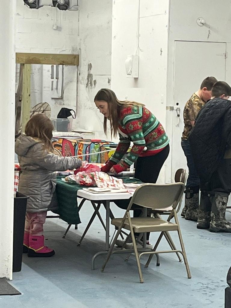 Volunteers unloading food donations at the receiving door